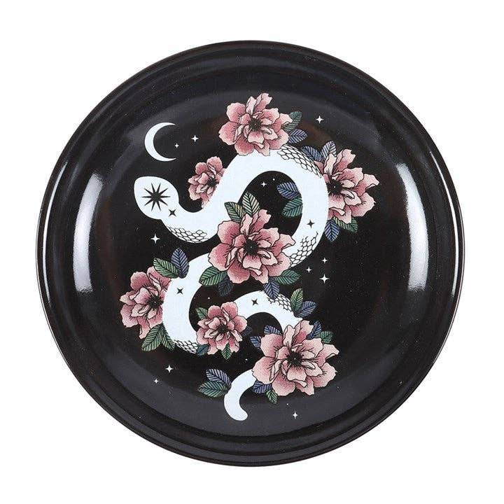 Snake and Flower Celestial Trinket Dish featuring white curled serpent and pink flower design against black starry sky for mystical gothic home decor