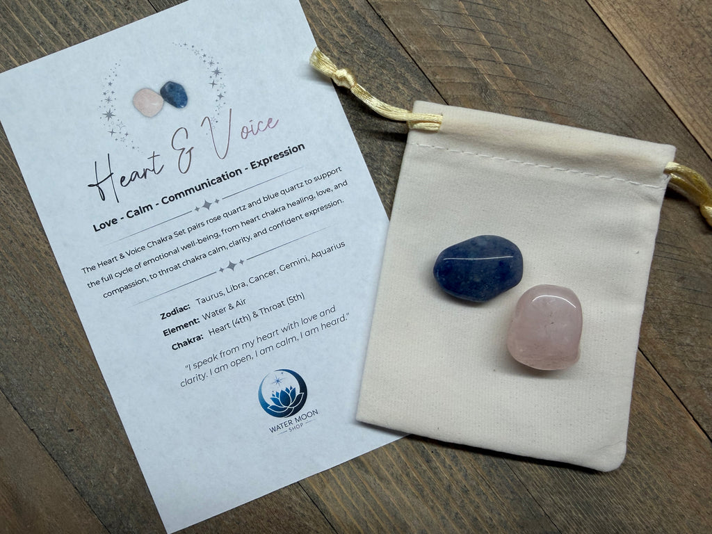 Two stones in a drawstring bag with an informational card on a wooden surface