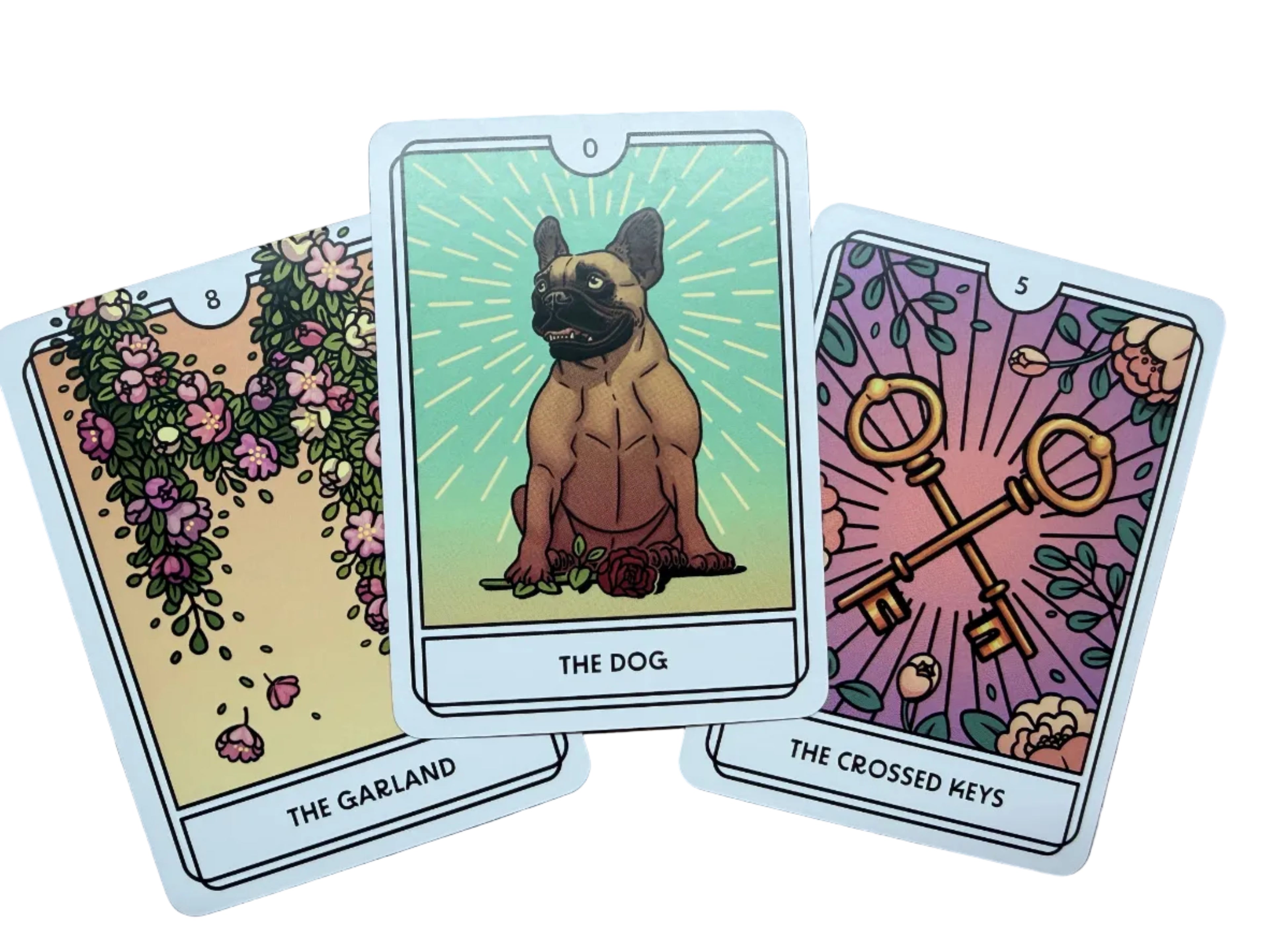 Three tarot cards on a wooden surface, featuring 'The Garland', 'The Dog', and 'The Crossed Keys'.