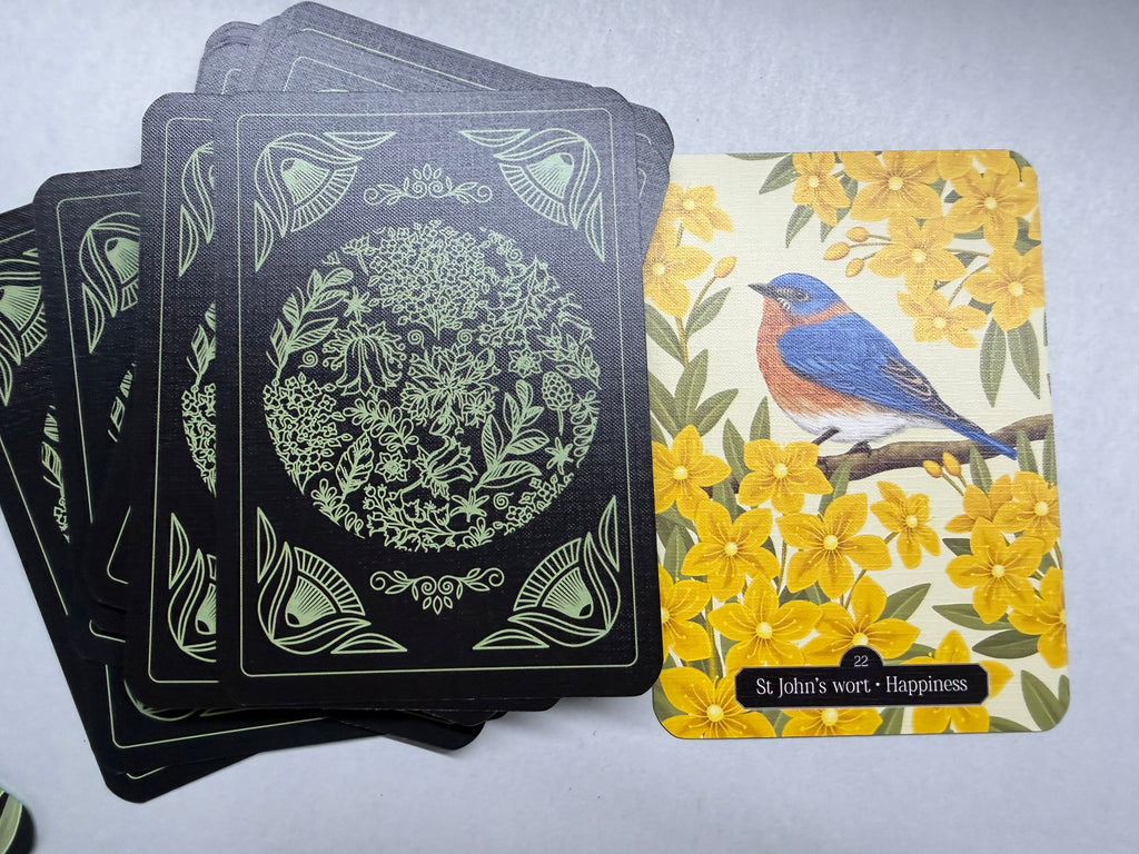 Set of playing cards with decorative designs on a gray surface