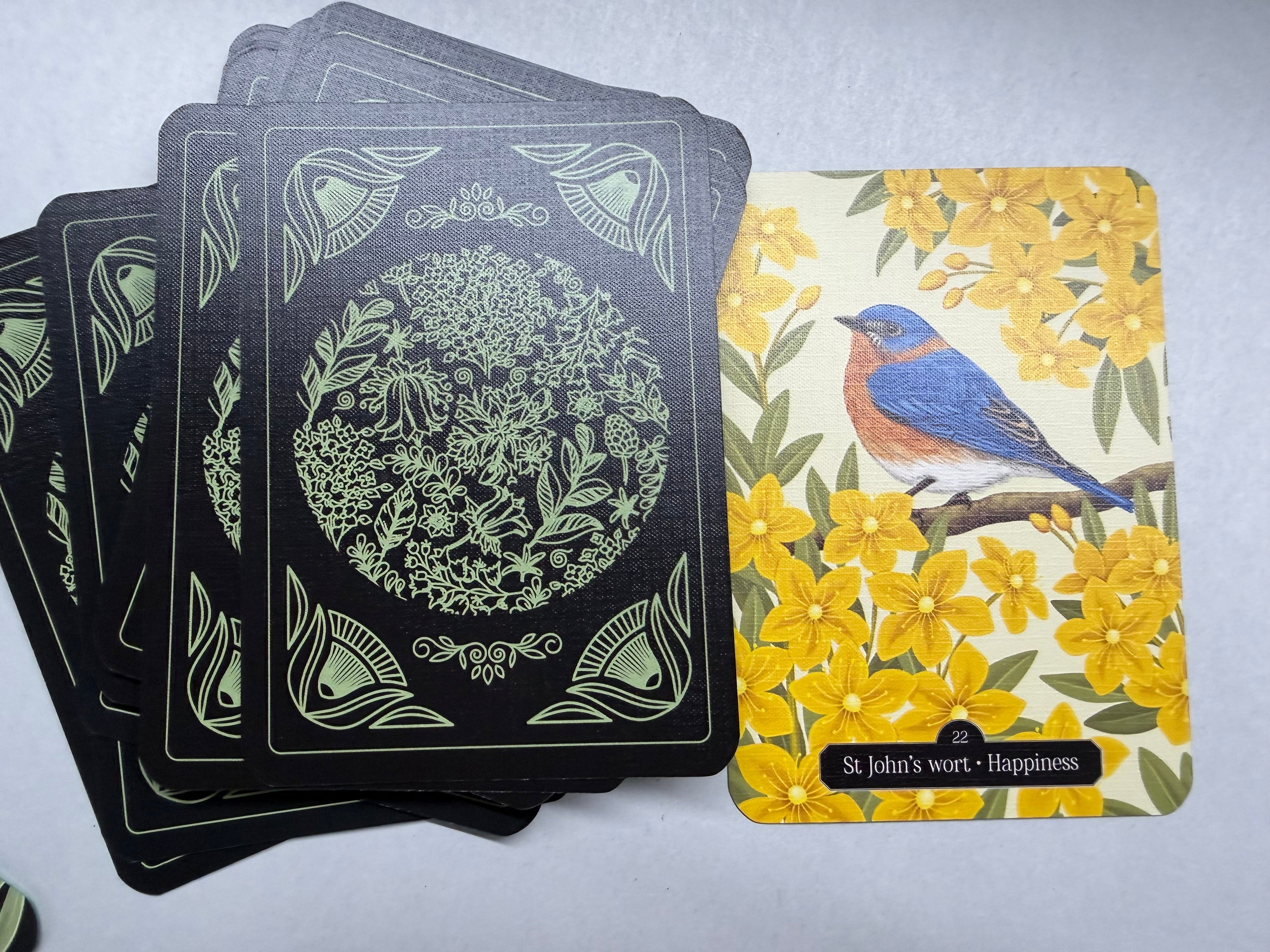 Set of playing cards with decorative designs on a gray surface