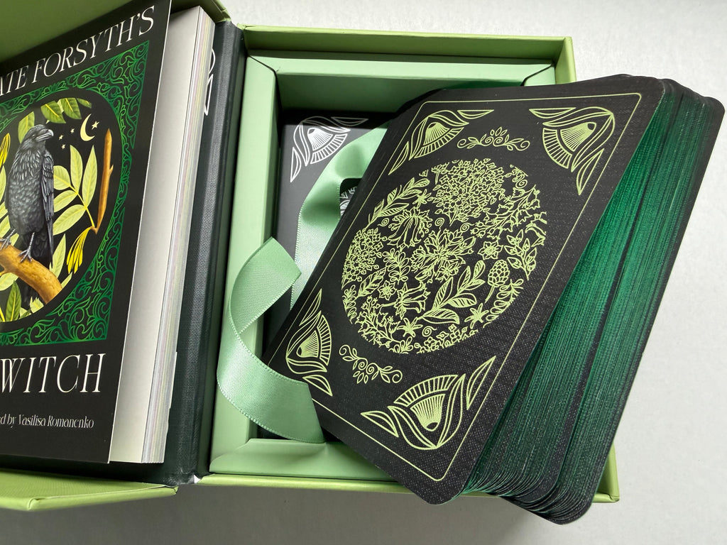Green and black card deck with decorative cover in a box