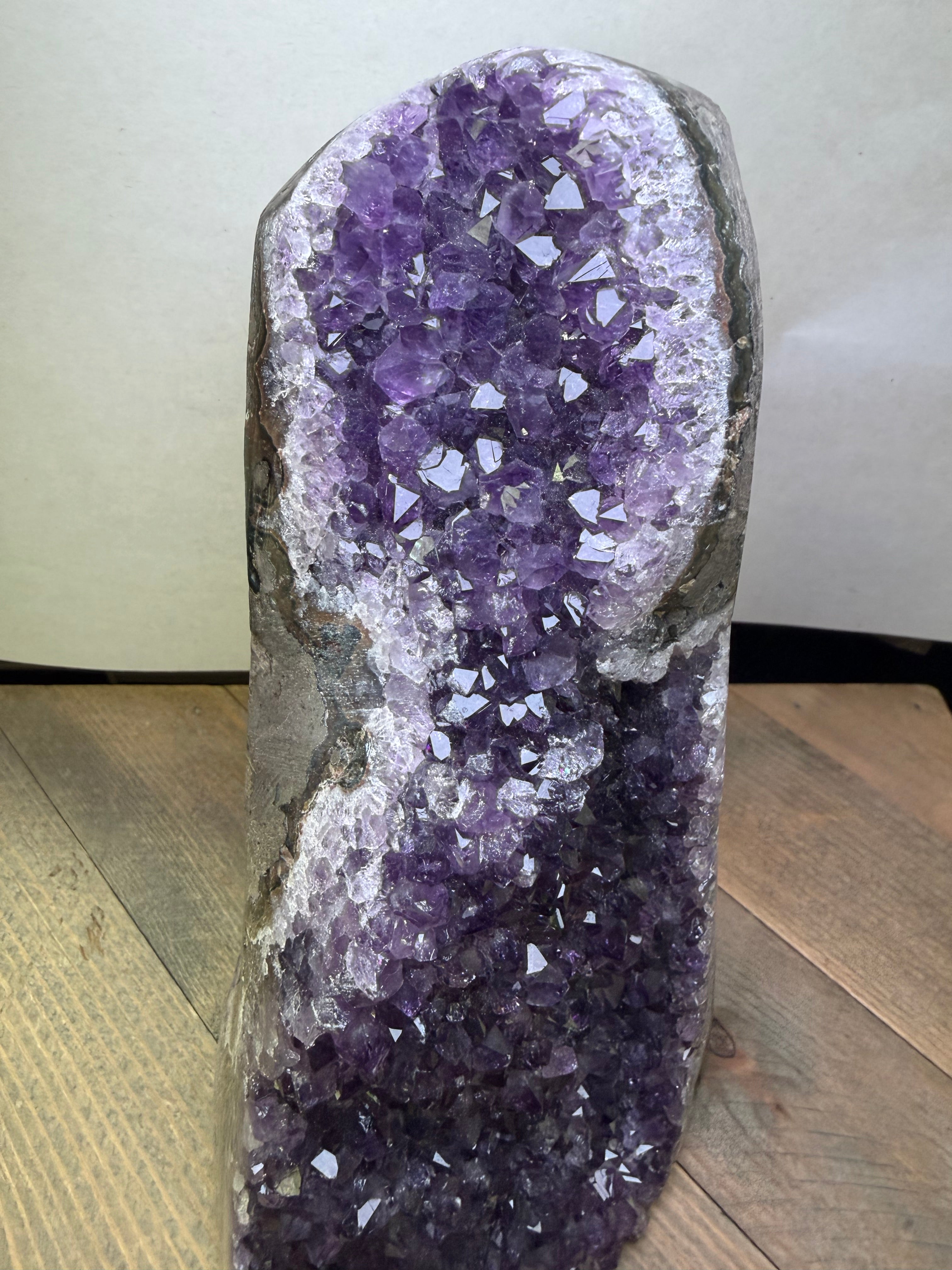 Amethyst crystal geode on a wooden surface