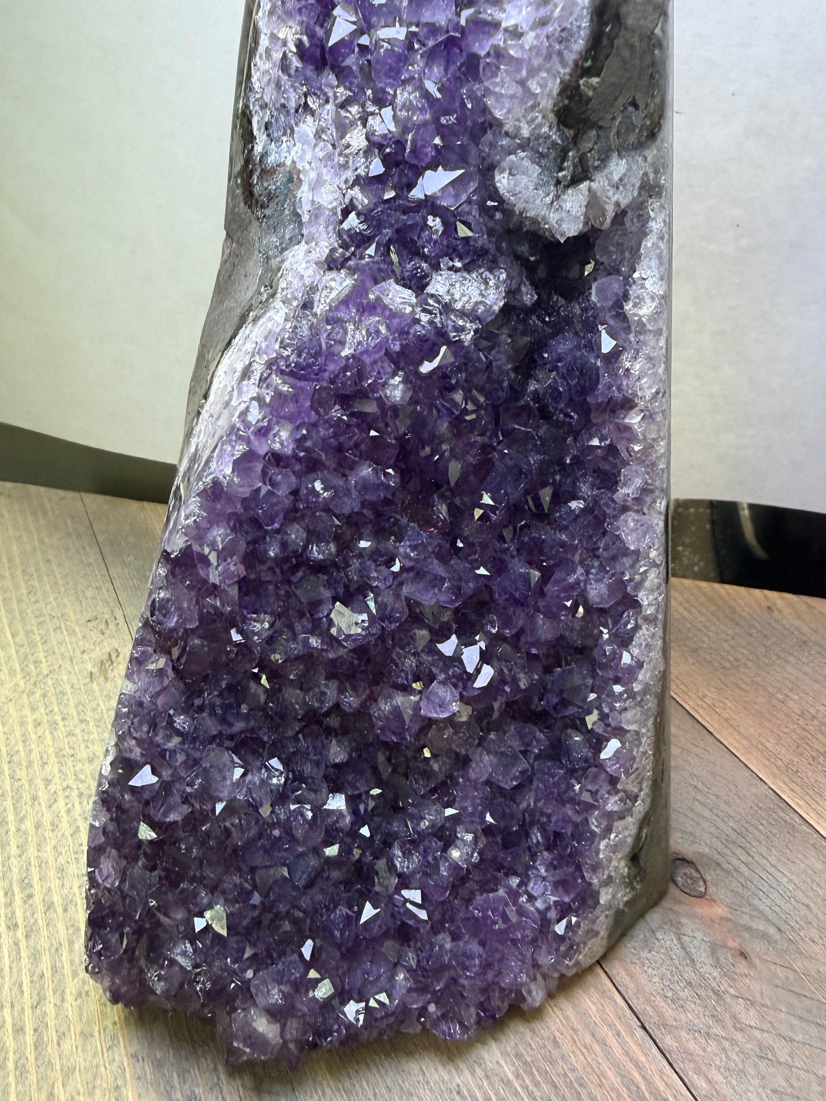 Amethyst crystal on a wooden surface