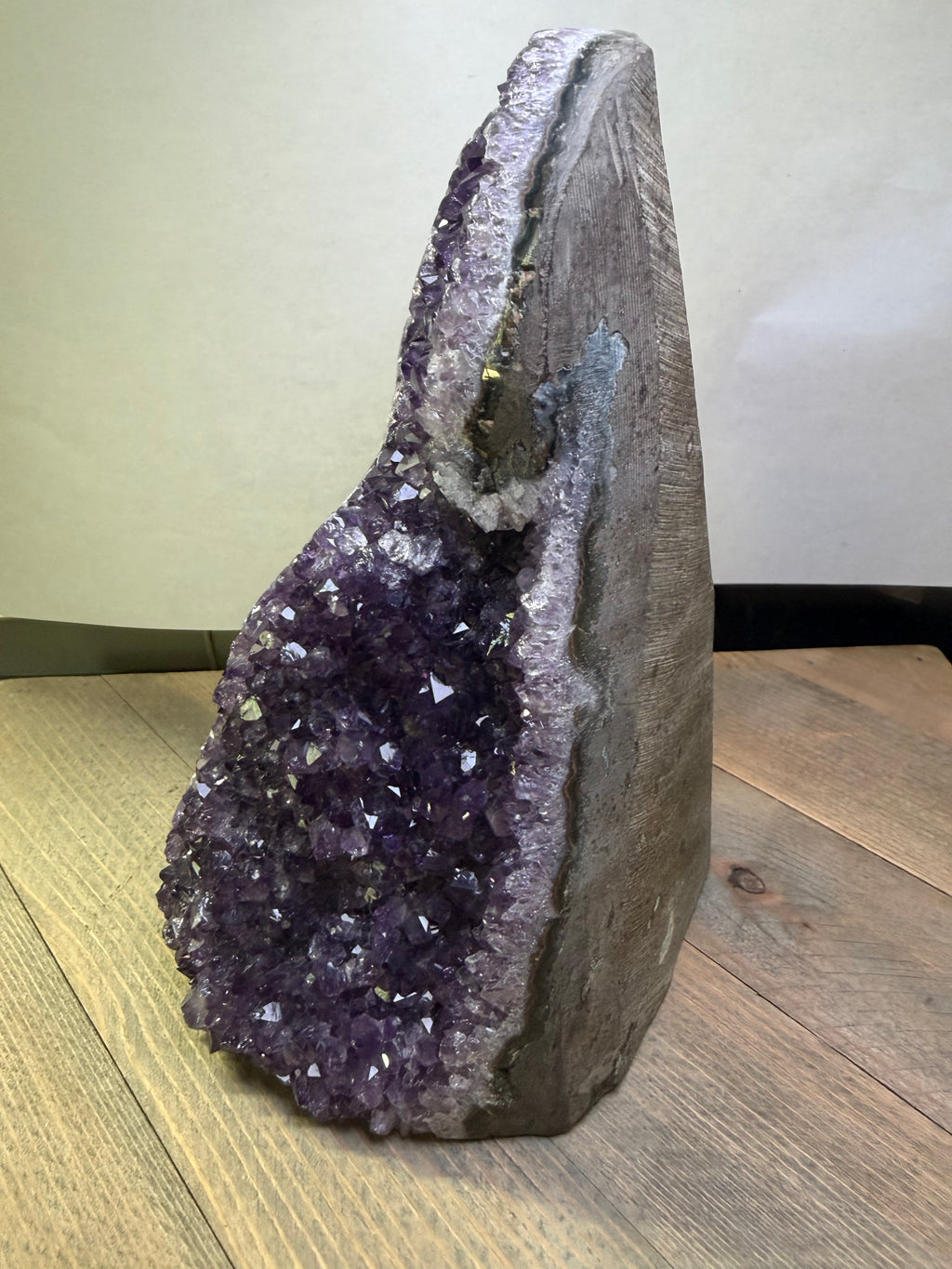 Amethyst geode on a wooden surface