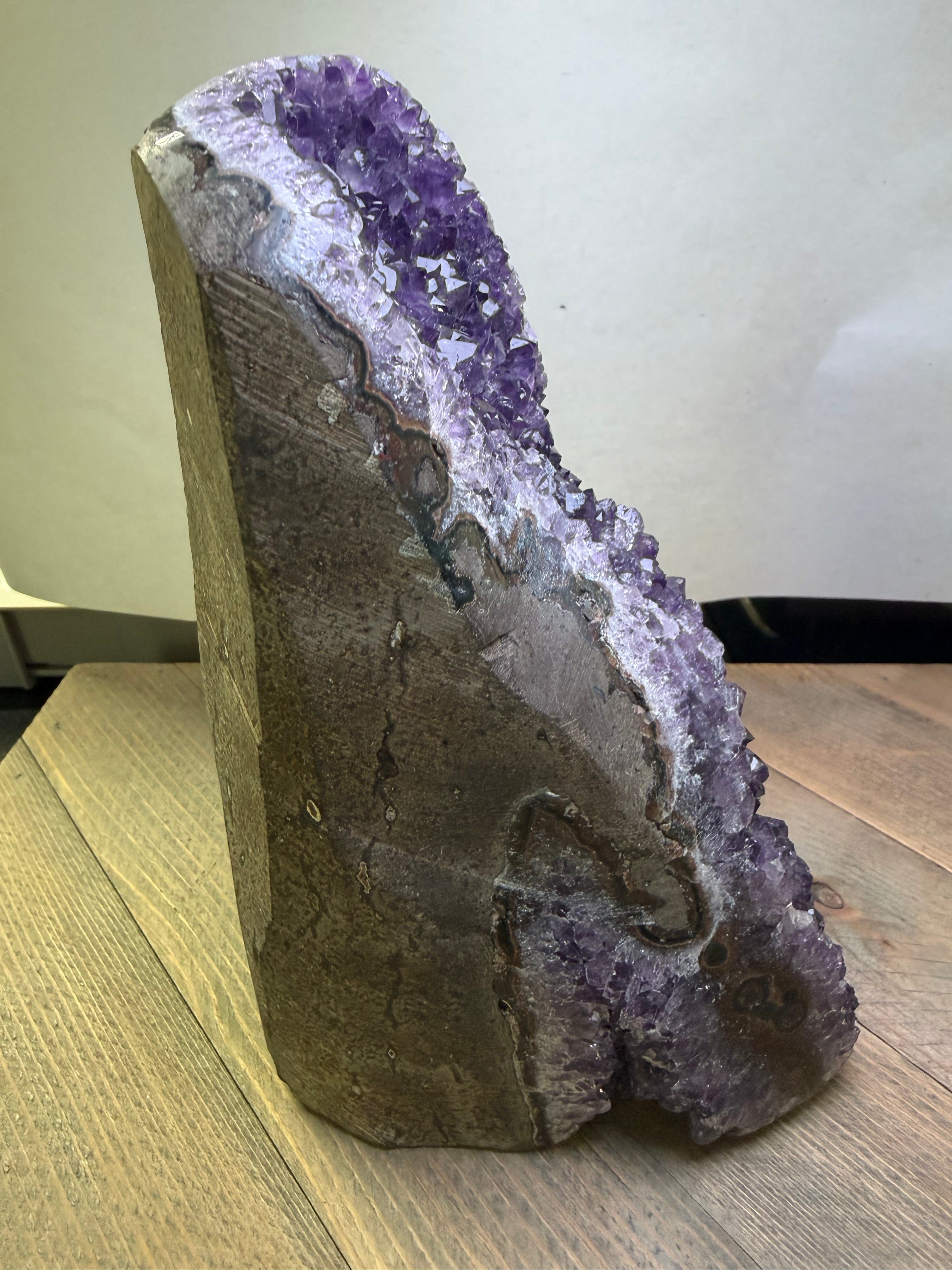 Amethyst crystal on a wooden surface
