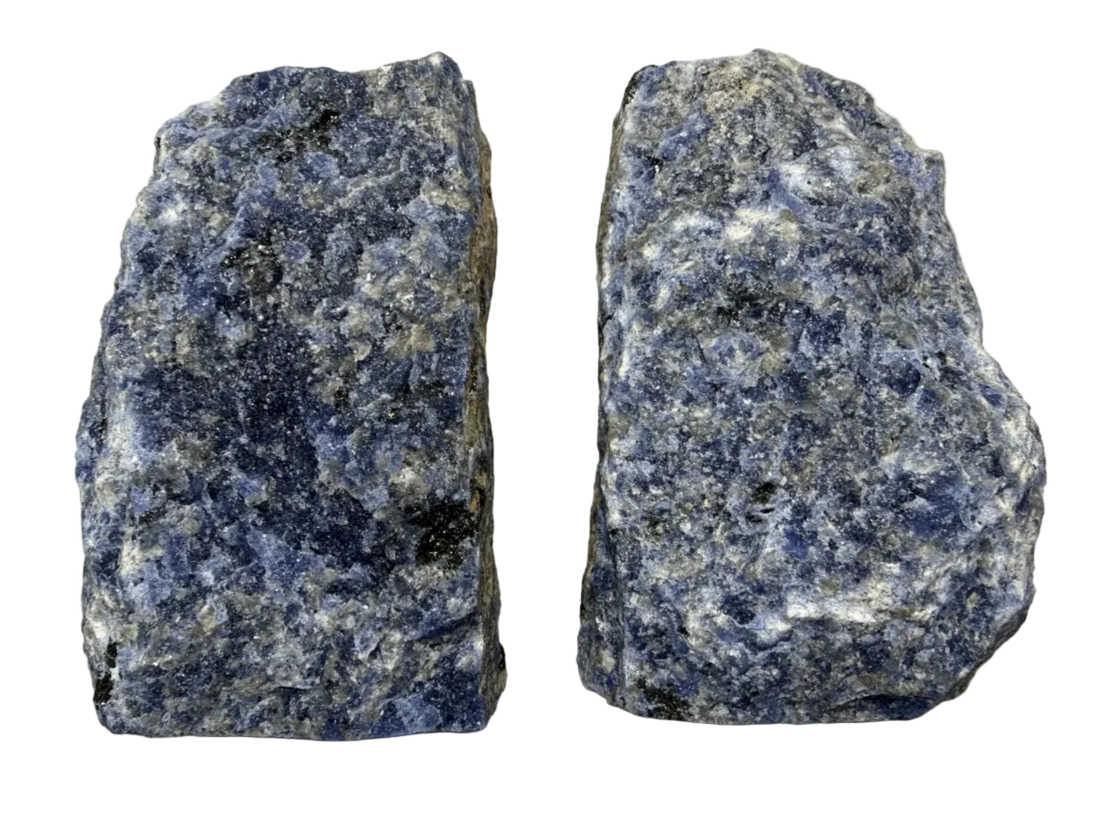 Two rough blue and white speckled stone blocks, likely lapis lazuli or similar mineral specimens, displayed side by side on a light beige background.