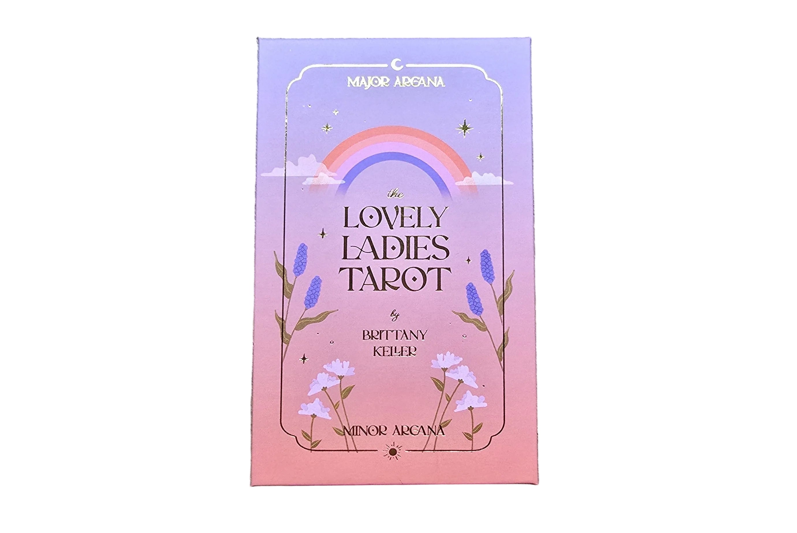 Card deck packaging with a rainbow and floral design on a wooden surface